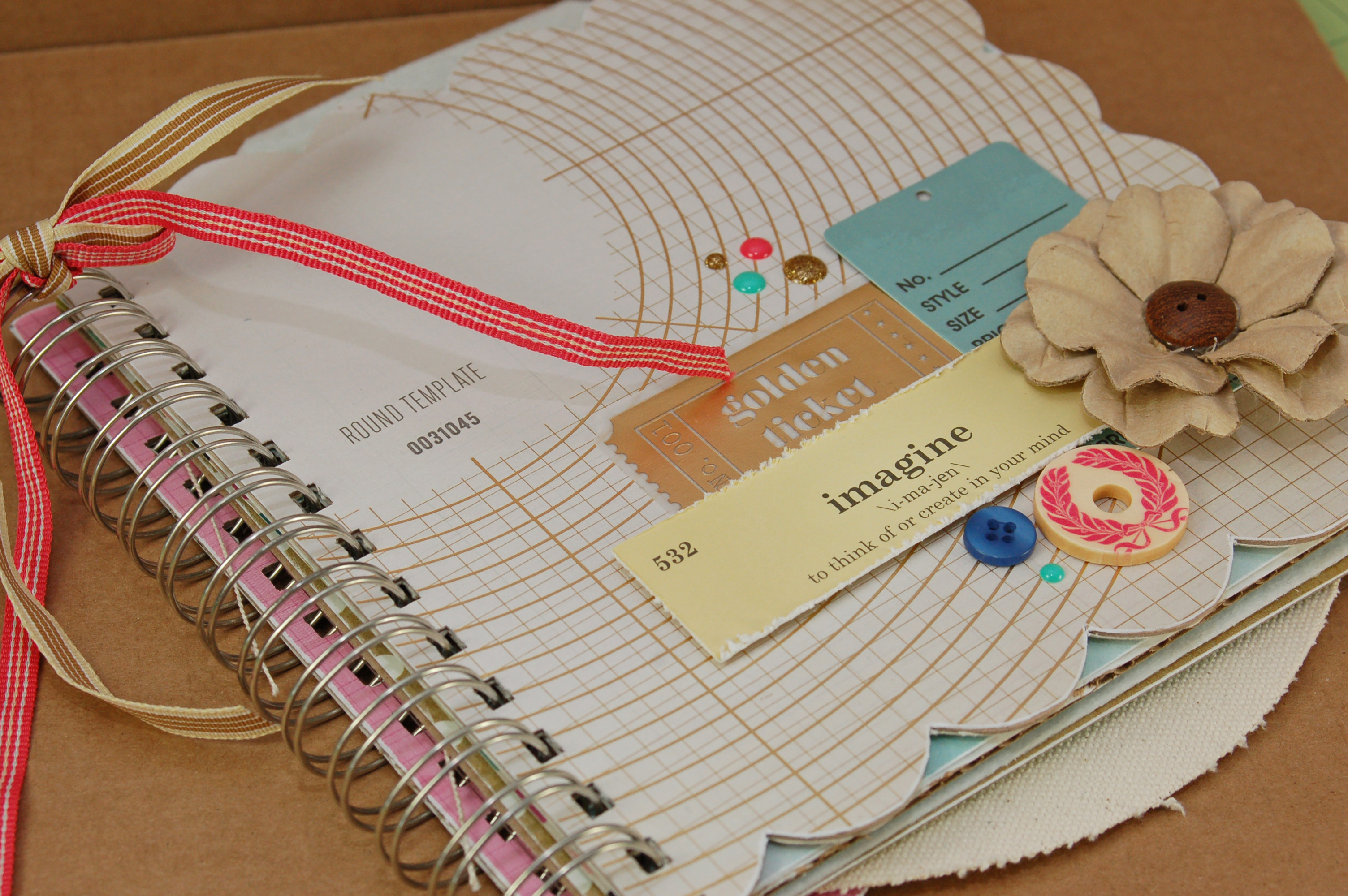 Altered album with travel themed paper and pages in different materials and shapes